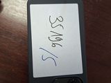 a picture of a cell phone with a price tag attached to it