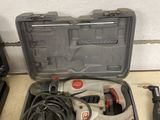 an image of a tool kit sitting on top of a counter next to other tools