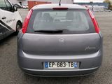 a small car that is parked in a parking lot