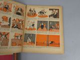 an open book with pictures of people and animals on it