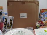 a table with a lot of items on it and a cardboard box