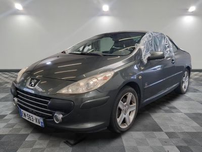 grey car in a room with checkered floor and lights