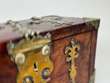 a small wooden box with a lock on it