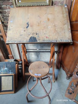 a table with a stool and a mirror on top of it