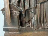 bronze statue of a woman holding a sword and a shield