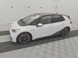the bmw i3 is parked in a garage with a checkered floor