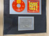 a framed picture of a cd and cd on display