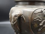 a small metal bowl with a horse on it