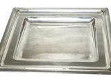 a close up of a metal tray on a white background