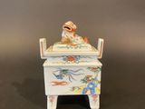 a figurine of a man in a bed with a dog on it