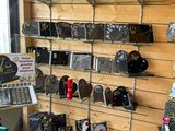 a wall with many different items on it in a store