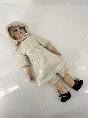 a doll that is laying down on the floor