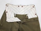 a close up of a pair of pants with buttons on them