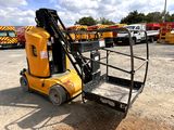 a forklift that is sitting in the dirt