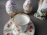 a cup and saucer on a saucer on a table