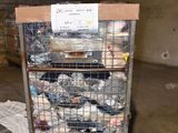 a cart full of garbage in a warehouse with a sign on it