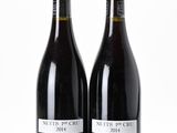 two bottles of wine sitting next to each other on a white surface
