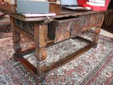 a wooden table with a laptop on top of it