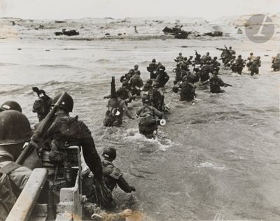a lot of soldiers that are walking in the water
