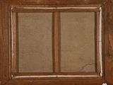 a close up of an old window with a brown frame