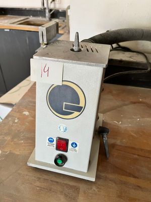 a machine that is sitting on top of a wooden table