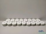 a lot of white pills sitting on a table