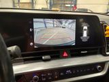 a view of a car ' s rear view mirror from inside the vehicle