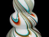 a white vase with a multicolored swirl on it