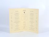 a close up of a folded menu on a white background
