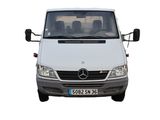 a white van that is parked on the side of the road