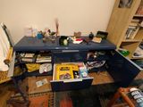 a blue desk with books on it in a room