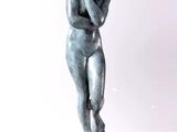 a statue of a man holding his head in his hands