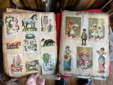 a person holding an open book with pictures on it