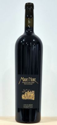 a bottle of wine that is sitting on a table