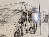 a drawing of an old airplane on display in a museum
