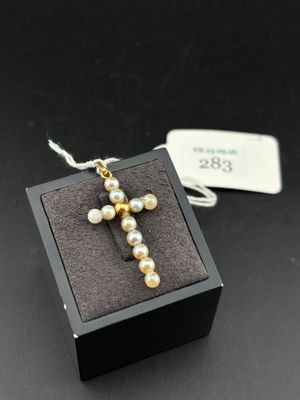 a close up of a small box with a cross on it