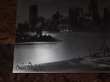a black and white photo of a city at night