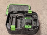 a black and green tool box with tools in it