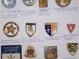 a lot of different military badges on a piece of paper