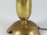 an antique brass table lamp with a glass shade on top of it