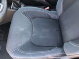 the interior of a car with the seat up and the steering wheel down