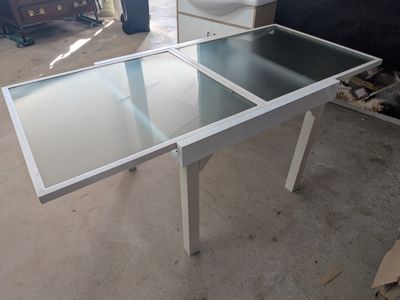 a table that has a glass top on it