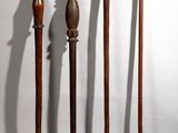several different types of weapons are lined up on a white surface