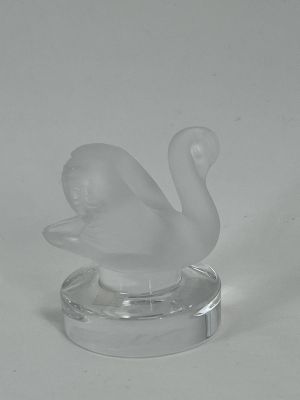 clear glass figurine of a swan on a clear base