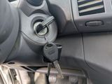 a car dashboard with a bunch of keys in it