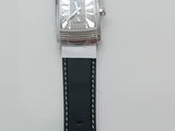 an image of a watch on a white surface with a black strap