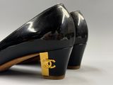 chanel black patent pumps with gold buckles