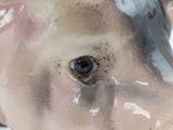 a close up of a ceramic cow head on a table