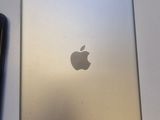 an ipad and a cell phone sitting next to each other