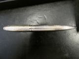 a pen sitting on top of a black table